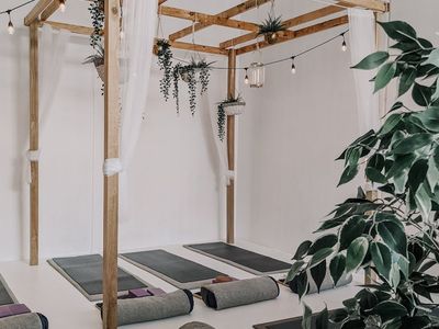 A clean and minimalist yoga studio space.